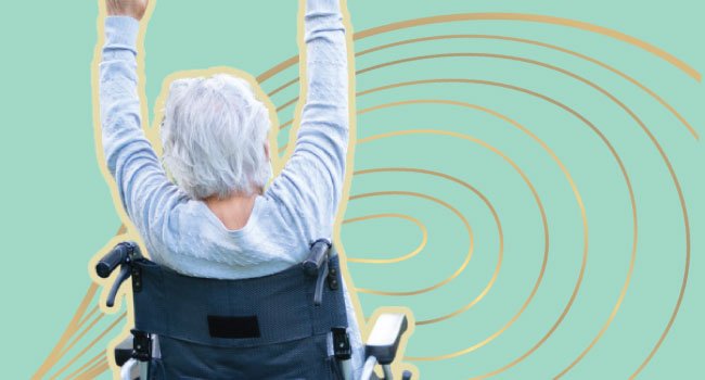 SHE RECOVERS Embodiment Studio Senior woman doing yoga in wheelchair SHE RECOVERS Embodiment Studio Senior woman doing yoga in wheelchair